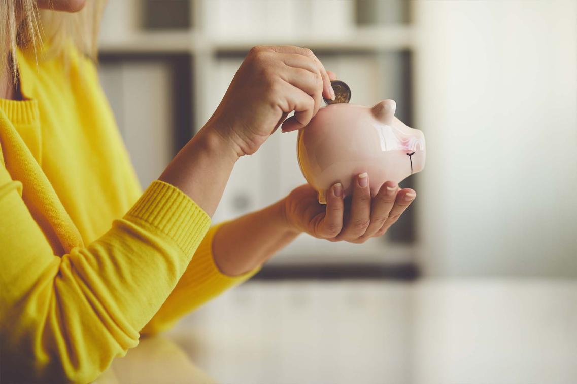 Woman holding piggy bank