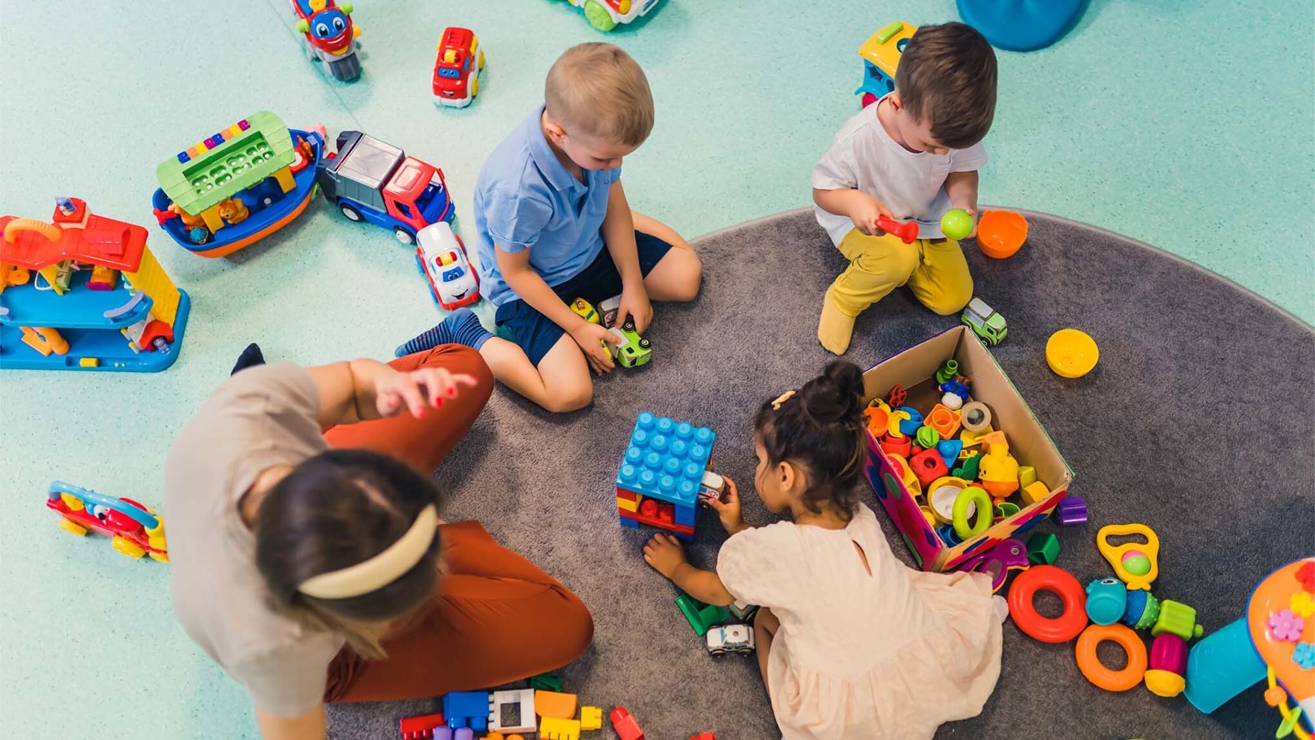 Children playing with bricks in a sure start centre