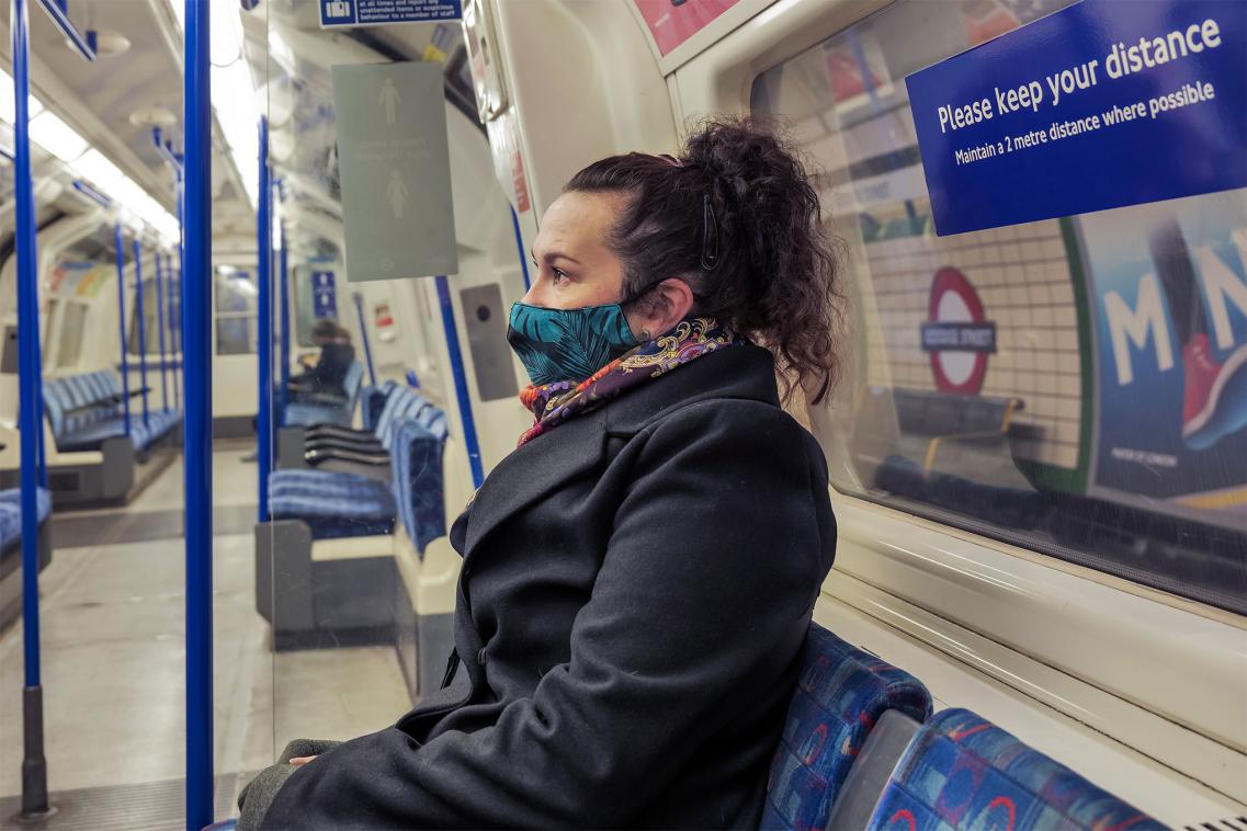 Woman wearing mask on tube